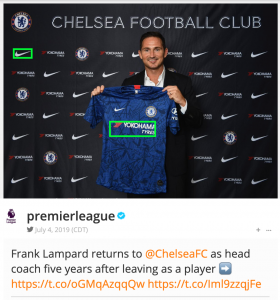chelsea soccer coach holding jersey